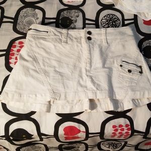 Mini skirt  is size medium but can fit small